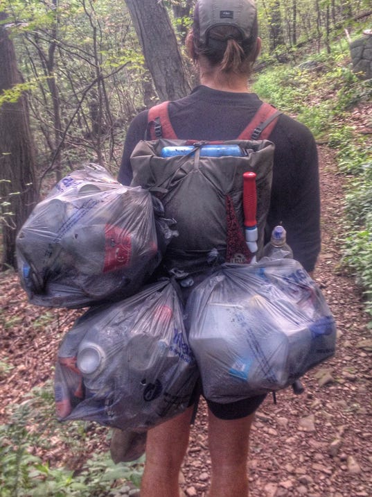 Asheville hikers tackle trails with trash bags