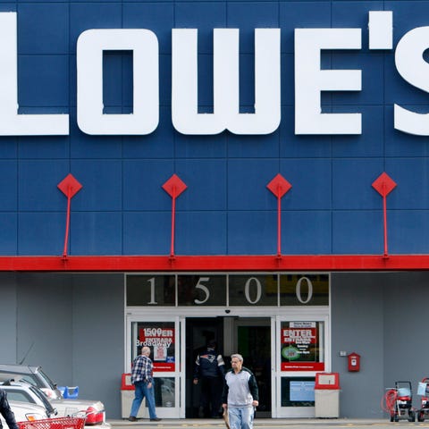 Customers enter and exit a Lowe's store in Saugus,