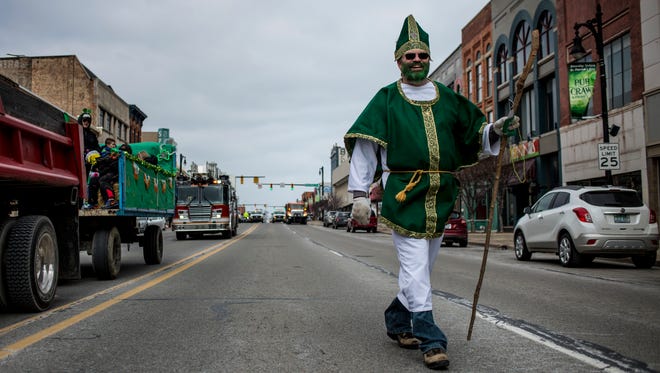 Dale Kelley of Port Huron is dressed as St. Patrick during the St. Patrick's Day Parade in 2017. The forecast for today's parade is sunny skies and 33 degrees.
