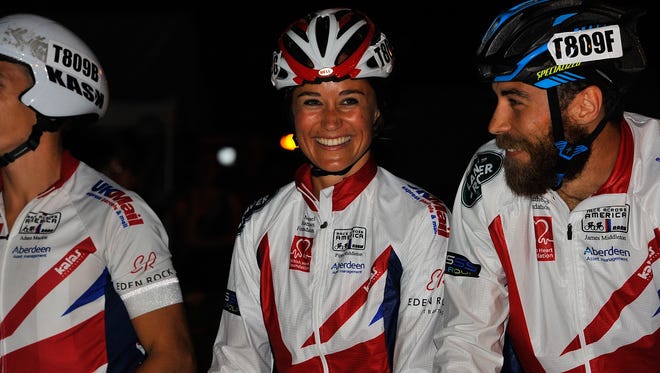 Pippa Middleton (C) smiles after finishing the Race Across America 2014 on June 20, 2014 in Annapolis, Maryland.