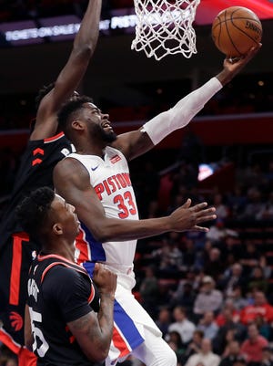 James Ennis III makes a layup over the Raptors' Delon Wright, front, and Pascal Siakam on Wednesday at LCA.