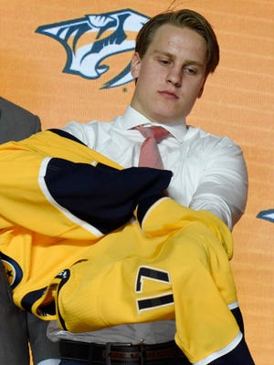 Eeli Tolvanen poses for photos after being selected as the 30th overall pick to the Nashville Predators in the first round of the 2017 NHL Draft at the United Center.  