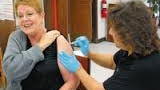 With a smile on her face, this Ruidoso residents prepares for her annual flu shot.