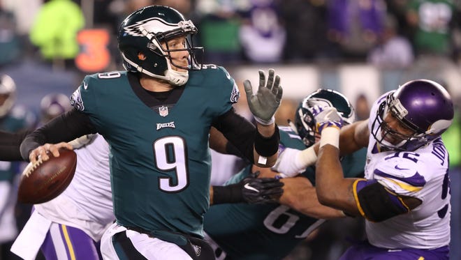 Philadelphia Eagles quarterback Nick Foles throws the ball past Minnesota Vikings defensive tackle Tom Johnson in the second half during the NFC Championship Game.