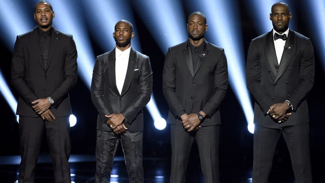 NBA basketball players Carmelo Anthony, from left, Chris Paul, Dwyane Wade and LeBron James speak on stage at the ESPY Awards at the Microsoft Theater on Wednesday, July 13, 2016, in Los Angeles. (Photo by Chris Pizzello/Invision/AP)