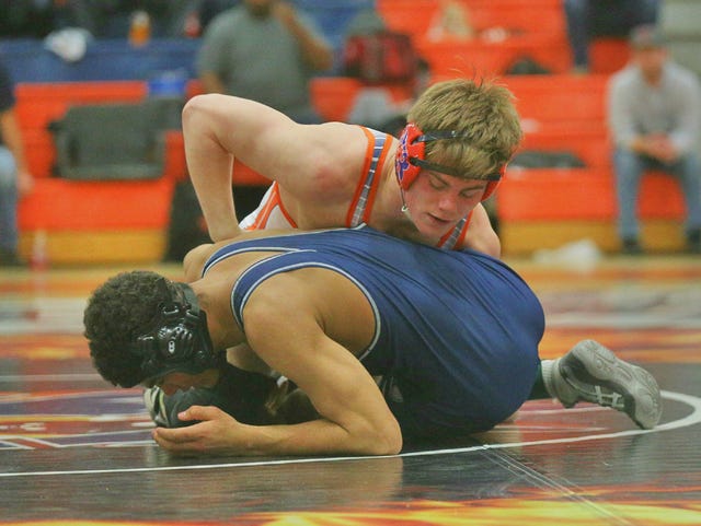 Blackman's Landon Fowler battles Siegel's Kenneth Phillips during last year's region tournament. Fowler won the state in the 170-pound division while Phillips is a returning state qualifier.