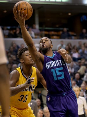 Charlotte Hornets guard Kemba Walker (15) lays up a shot around Indiana Pacers forward Myles Turner (33) in the second half of their game Wednesday, Feb 10, 2016, evening at Bankers Life Fieldhouse. The Charlotte Hornets defeated the Indiana Pacers 117-95.