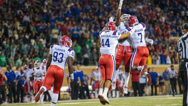 Louisiana Tech players celebrates after making a play against the North Texas Mean Green in the fourth quarter at Apogee Stadium. The Bulldogs have won six consecutive games, the longest streak since 2011.