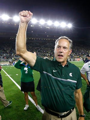 Michigan State head coach Mark Dantonio celebrates a win over Notre Dame after an NCAA college football game Saturday, Sept. 17, 2016, in South Bend, Ind.