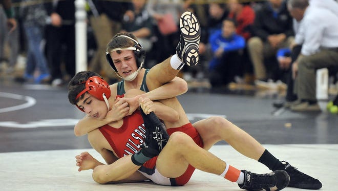 Clearview's David McCullough (rear) and Geno Duca of Paulsboro compete during their 106-pound bout in the Region 8 tournament Wednesday at Egg Harbor Township High School.