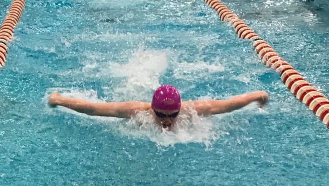 Lexington junior Connor Miller competes in the Division II preliminaries of the 100 butterfly.