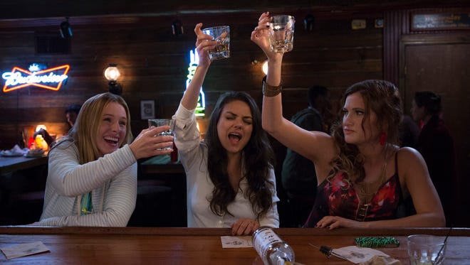 Kristen Bell, left, Mila Kunis and Kathryn Hahn toast their new 'Bad Moms' status.