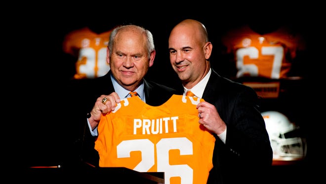 Tennessee athletic director Phillip Fulmer (left) introduces Jeremy Pruitt at UT's new football coach.