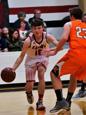 Roby's Holten Dickson (10) drives the baseline while Rotan's Cameron Thornton defends in a district game at Roby on Fri., Jan. 12, 2018.