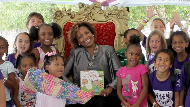 Jackie Parker, director of global philanthropy and corporate giving at General Motors, reads to Detroit students on July 28, 2016 for Reading and Rhythm on the Riverfront. The program, managed by the Detroit Riverfront Conservancy and funded in part by the GM Foundation, offers weekly events to keep kids engaged and inspired to learn during the summer months.