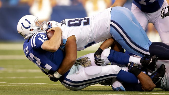 Indianapolis Colts quarterback Andrew Luck (12) is sacked by Tennessee Titans nose tackle Austin Johnson (94) in the second half of  their NFL football game Sunday, November 20, 206, afternoon at Lucas Oil Stadium. The Colts defeated the Titans 24-17.