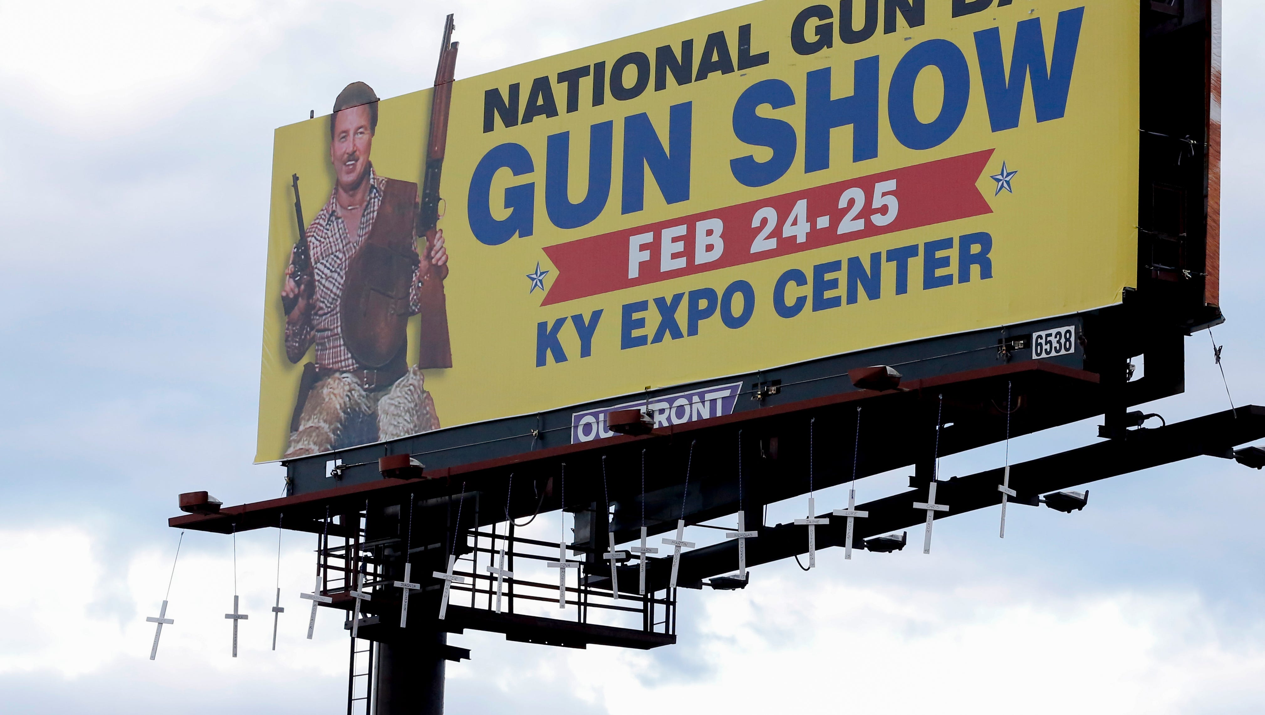 Crosses for Florida shooting hung on Louisville gun show billboard