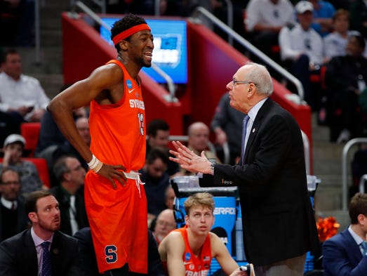 Syracuse center Paschal Chukwu talks with coach Jim