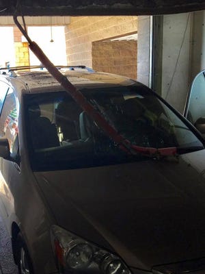 A pole inside a Fond du Lac car wash shattered a car windshield Thursday morning