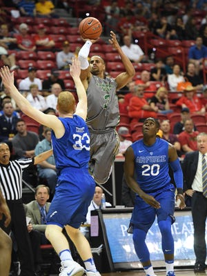 CSU's Gian Clavell shoots over Air Force's Frank Toohey during a Mountain West tournament quarterfinal game Thursday night in Las Vegas. Clavell made 6 of 11 3-pointers and scored 30 points in the Rams' 81-55 win.