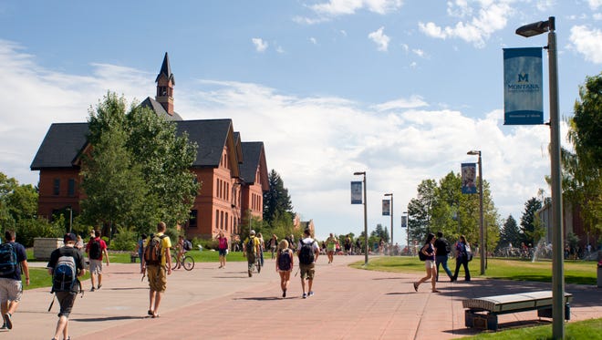 Students make their way through campus at Montana State University in Bozeman, Aug. 29, 2011.