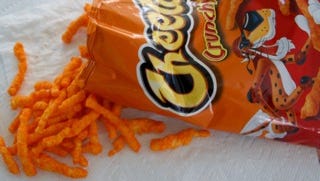 "For some reason, it’s okay to eat junk food on a trip, for example, this guilty pleasure, crunchy Cheetos. Bring wet wipes to clean off the orange powder." -Terri Peterson Smith