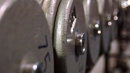 Row of weights in fitness club.