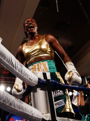 Claressa Shields celebrates after defeating Nikki Adler at the WBC and IBF super middleweight title fight at MGM Grand Detroit, Friday, August 4, 2017.