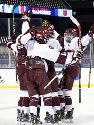 Don Bosco celebrates its second goal of the first period, scored by George Weiner, as the Ironmen routed the Hun School, 8-1, under the lights at Citi Field on Wednesday, Jan. 3, 2018. The teams used the same outdoor rink that the NHL's Winter Classic did when the Buffalo Sabres hosted the New York Rangers at the home of the New York Mets on New Year's Day.