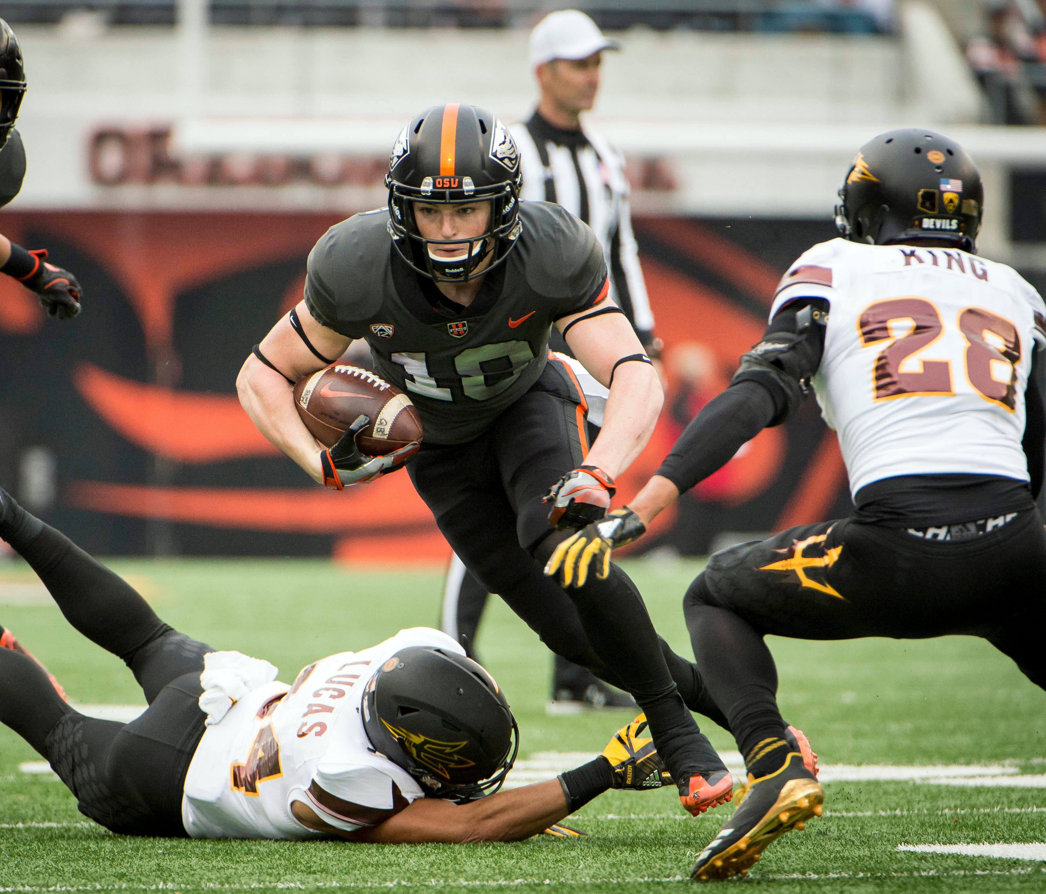Oregon State wide receiver Timmy Hernandez tries to find running room against Arizona State during their game in 2017.