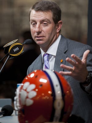 Clemson coach Dabo Swinney talks with reporters during the media day on Saturday at the Convention Center in Phoenix. The championship game will be held on Monday.