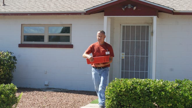 Danny Cordova walks quickly as he delivers up to 45 meals in under 2 hours for Meals on Wheels.