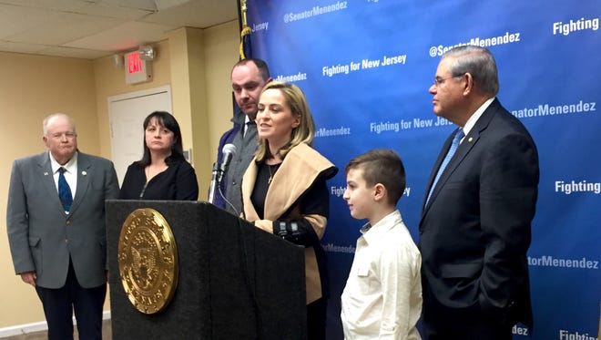 Nina Saria speaks at a press conference about her kidney transplant, along with Washington Township Mayor Dudley Lewis, her mother Nana Gulua, her husband Kay Saria, her son Nicholas Saria and Sen. Bob Menendez.