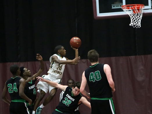 Martin Luther's Trequan Carrington goes up for a basket