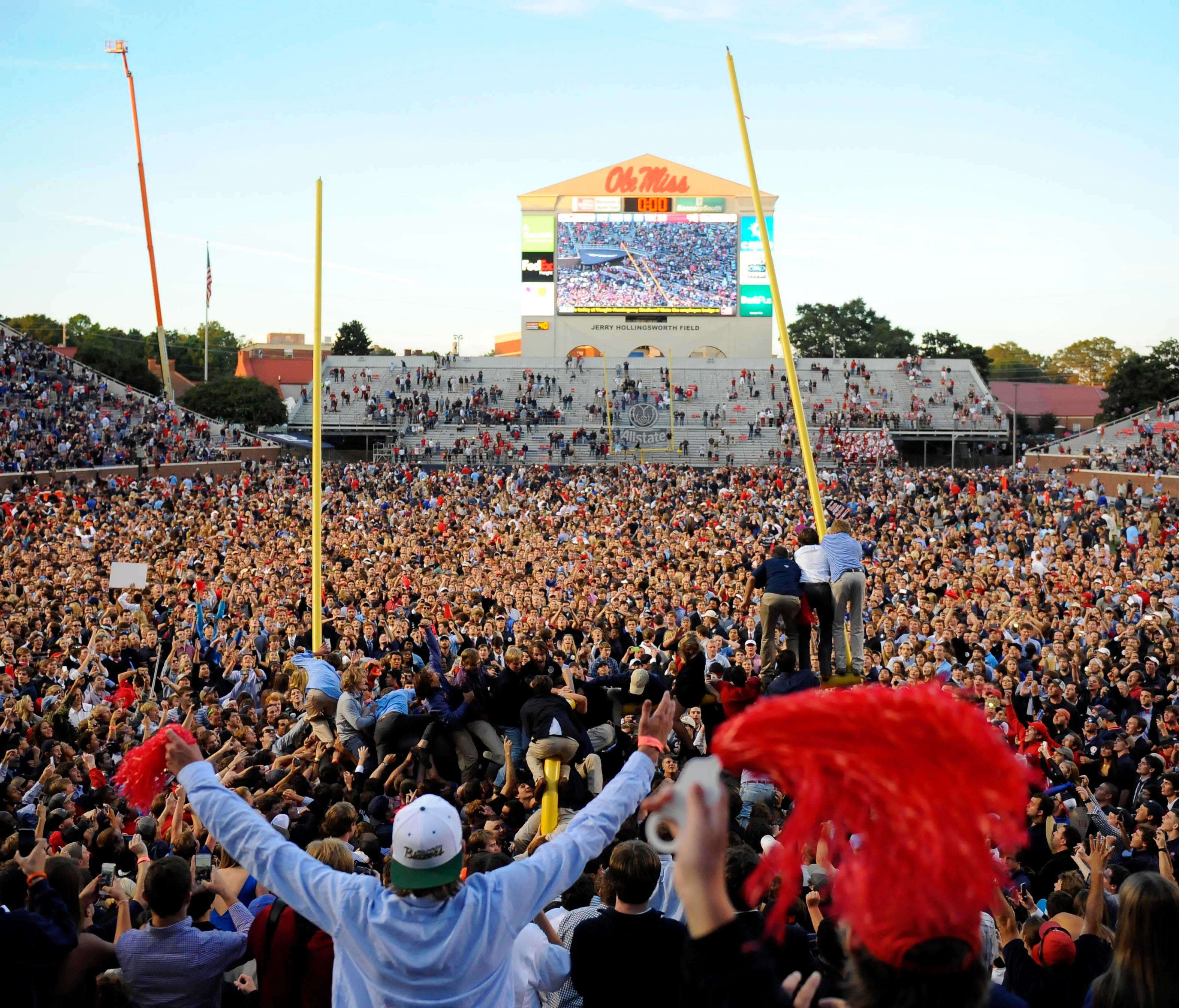 Ole Miss fans flood the field after beating Alabama in 2014.