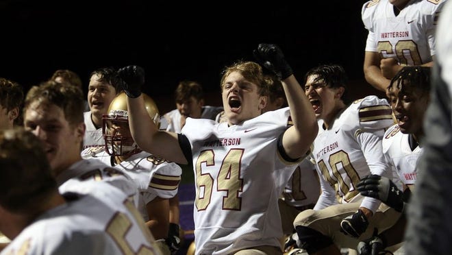 Watterson's Luke Riedlinger and the rest of the Eagles celebrate their 35-34 double-overtime win at DeSales on Sept. 18.