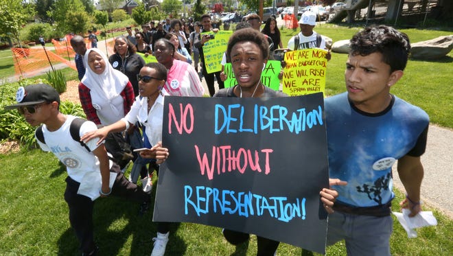 Students from Spring Valley High School march to Memorial Park in Spring Valley on May20  to protest the school board and conditions  at their school.