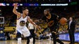 Kyrie Irving is defended by Stephen Curry during the