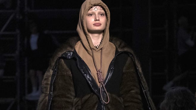 This Feb. 17, 2019, photo shows a model wearing a creation by Burberry at the Autumn/Winter 2019 fashion week runway show in London. The chief executive and chief creative officer of luxury powerhouse Burberry have apologized for putting a hoodie with strings tied in the shape of a noose on their London Fashion Week runway.