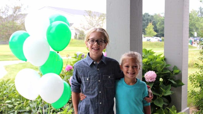 A couple students are pictured on the first day of school at ULS, which has seen 20 percent growth in its enrollment since the 2013-14 school year.
