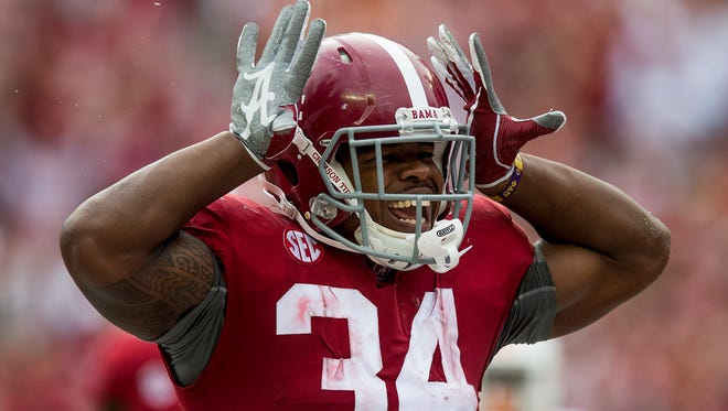 Alabama running back Damien Harris (34) celebrates a touchdown against Tennessee in first half action at Bryant-Denny Stadium in Tuscaloosa, Ala. on Saturday October 21, 2017.