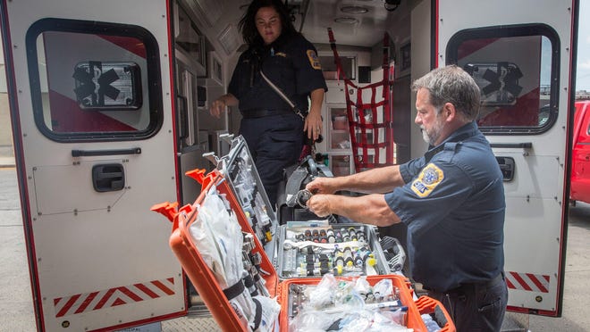 Rachel Clark and Greg Boucher, with Delaware County EMS, show equipment that they stock on the ambulances to treat a wide variety of injuries. Mayor Dennis Tyler is considering creating a city-based ambulance service that would take over duties normally done by the Delaware County EMS.