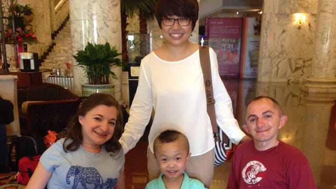 Adam and Kara Ayers are waiting in Guangzhou, China, with their adopted son Eli, 7. But their return has been delayed by a State Department computer problem issuing entry visas for adopted foreign-born children. 
Photos provided by: http://www.ayersadoption.com/