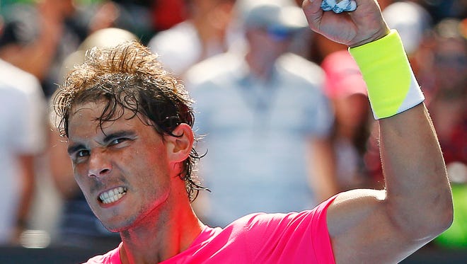 Rafael Nadal of Spain celebrates after defeating Mikhail Youzhny of Russia in their men's singles first round match at the Australian Open 2015 tennis tournament.