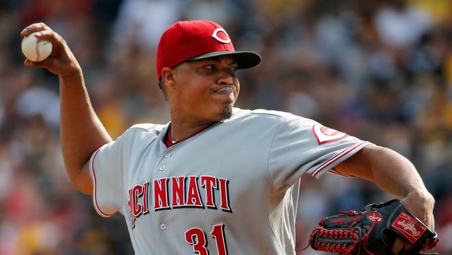 In this Aug. 30, 2014, file photo, Cincinnati Reds starting pitcher Alfredo Simon (31) delivers during the first inning of a baseball game against the Pittsburgh Pirates in Pittsburgh.