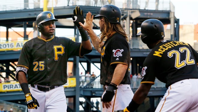 Pittsburgh Pirates' Gregory Polanco (25)  celebrates with teammates John Jaso, center, and Andrew McCutchen who were on base for his three run home run off Arizona Diamondbacks starting pitcher Shelby Miller during the first inning of a baseball game in Pittsburgh, Tuesday, May 24, 2016.