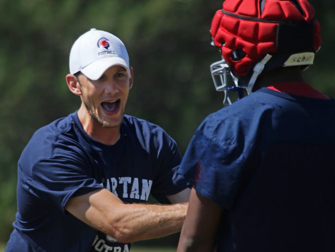 New Brookfield East football coach Ben Farley demonstrates