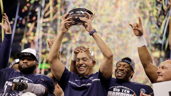 Coach James Franklin celebrates with his Nittany Lions after winning the Big Ten title in Indianapolis. Next stop? The Lions put their nine-game winning streak on the line vs. USC in the Rose Bowl.