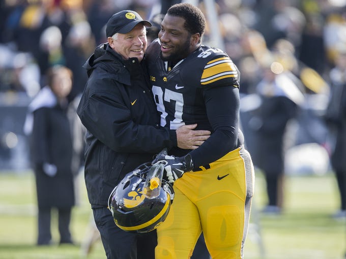 Iowa's Darian Cooper with defensive line coach Reese