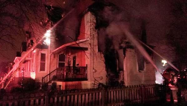Firefighters struggle to control a fire in Hartwell Monday night.